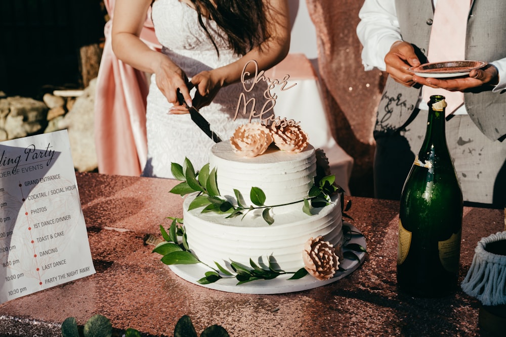 woman in white dress holding white and blue floral ceramic bowl with food