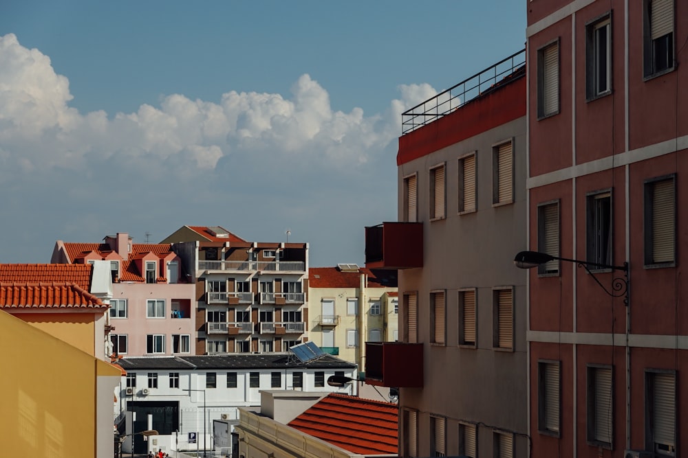 red and white concrete building under blue sky during daytime