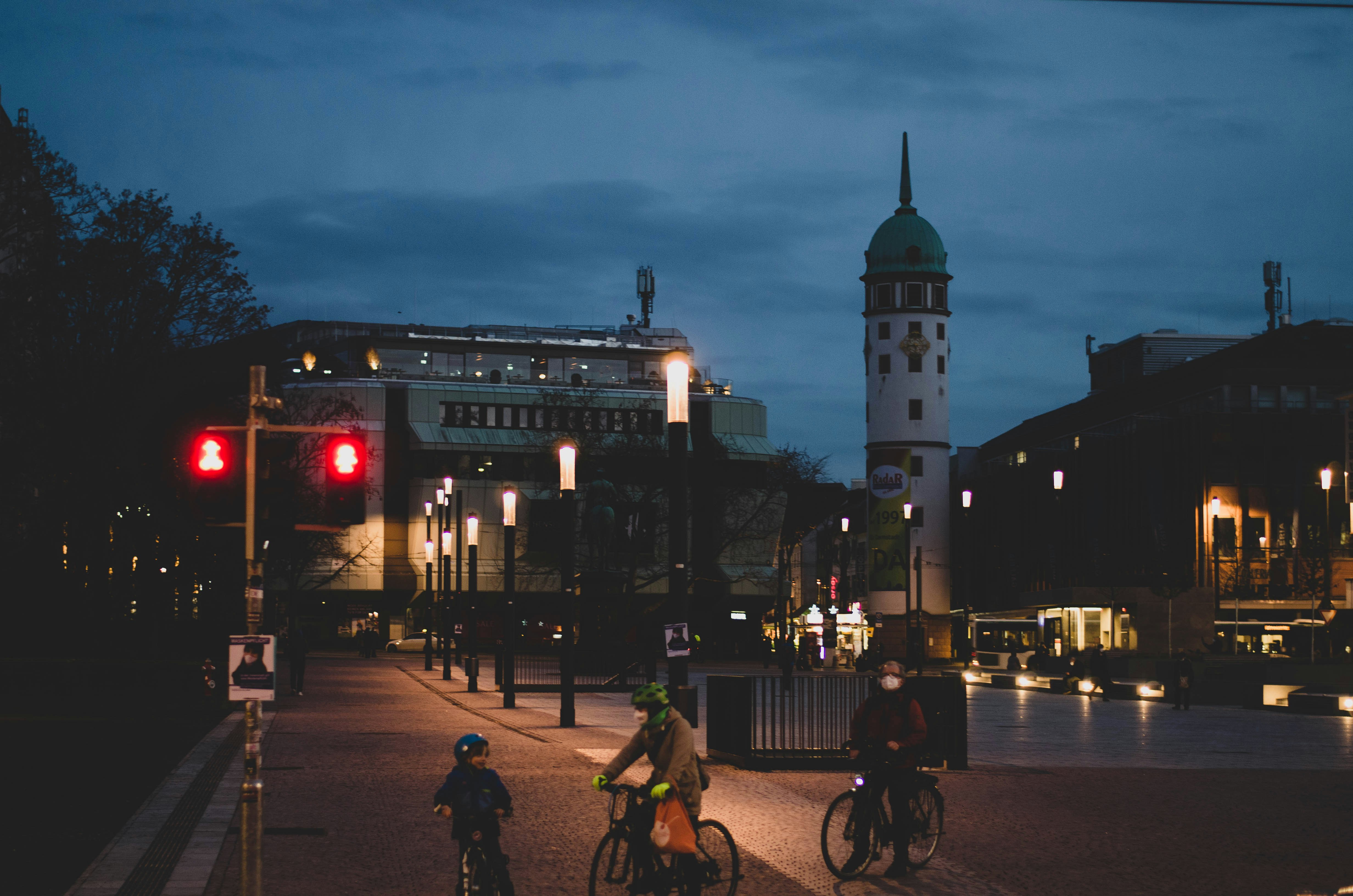 people walking on street during night time