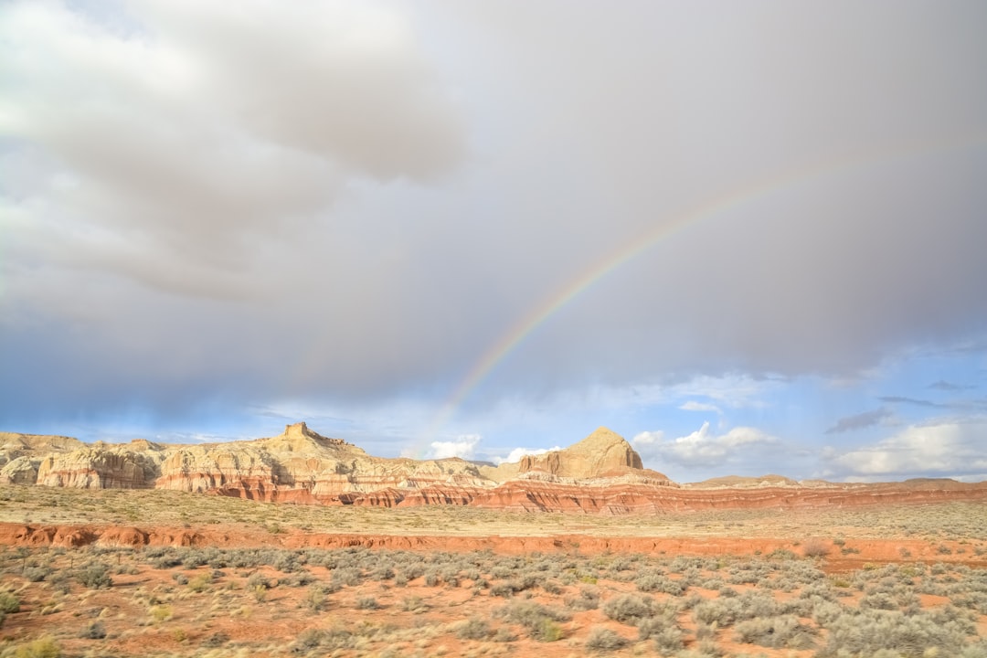 brown sand under white clouds