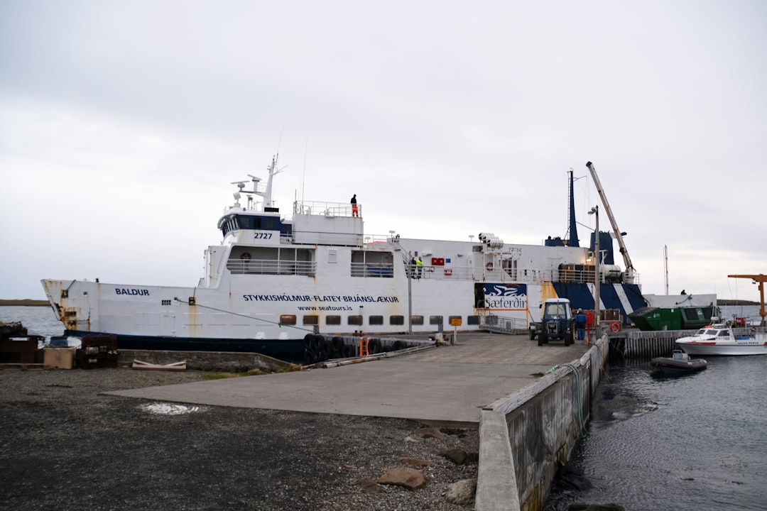 white and blue ship on sea during daytime