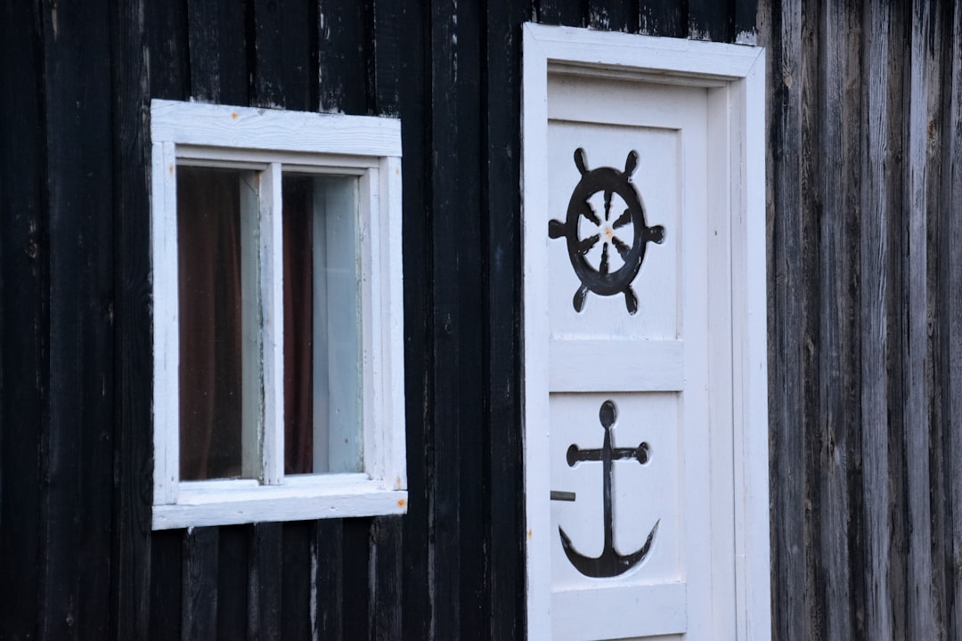 white wooden door with cross
