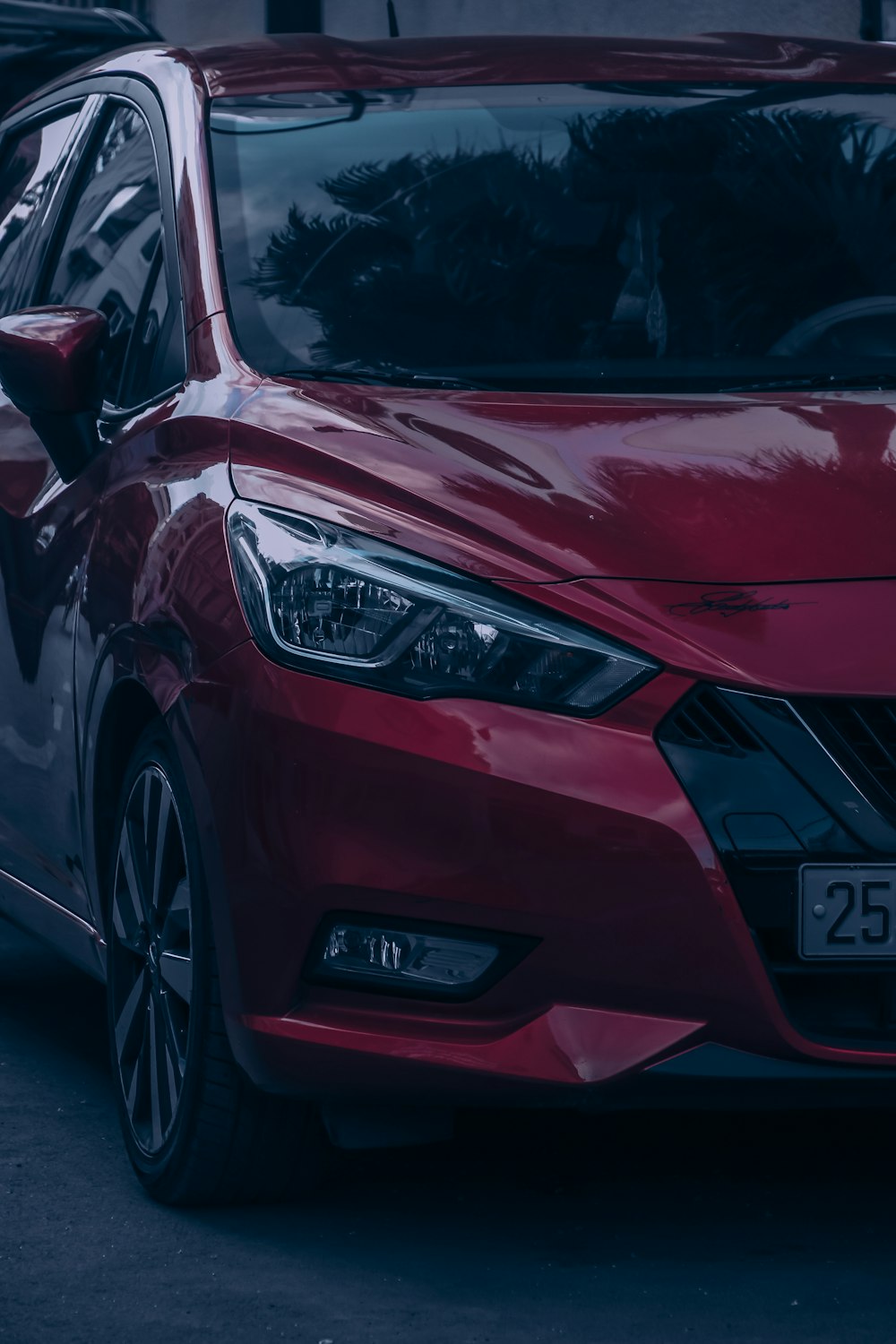 red car on gray asphalt road