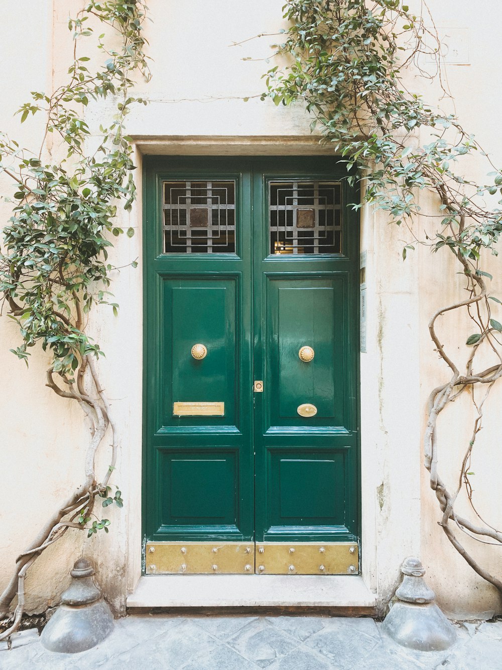 blue wooden door on white concrete wall