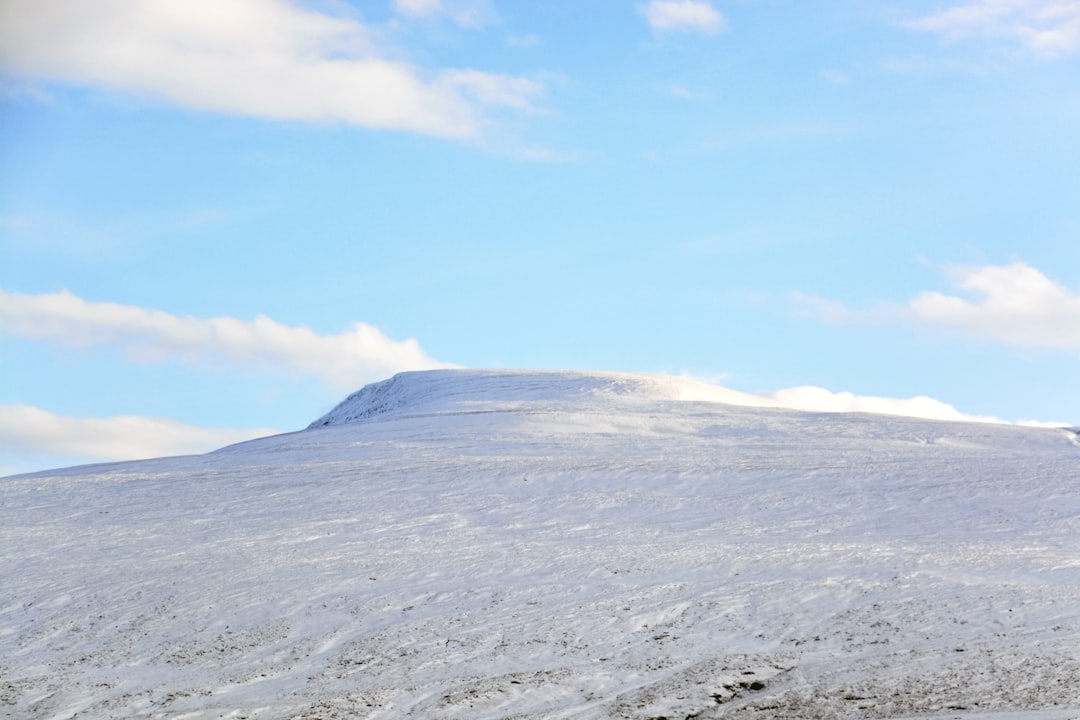 white and black mountain under blue sky during daytime