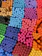 Close-up of colorful pens neatly arranged on a wooden desk.