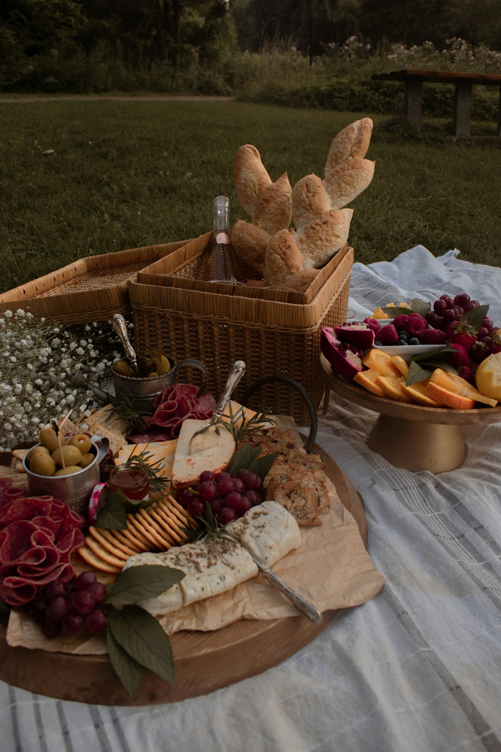 bread and sliced fruits on brown woven basket