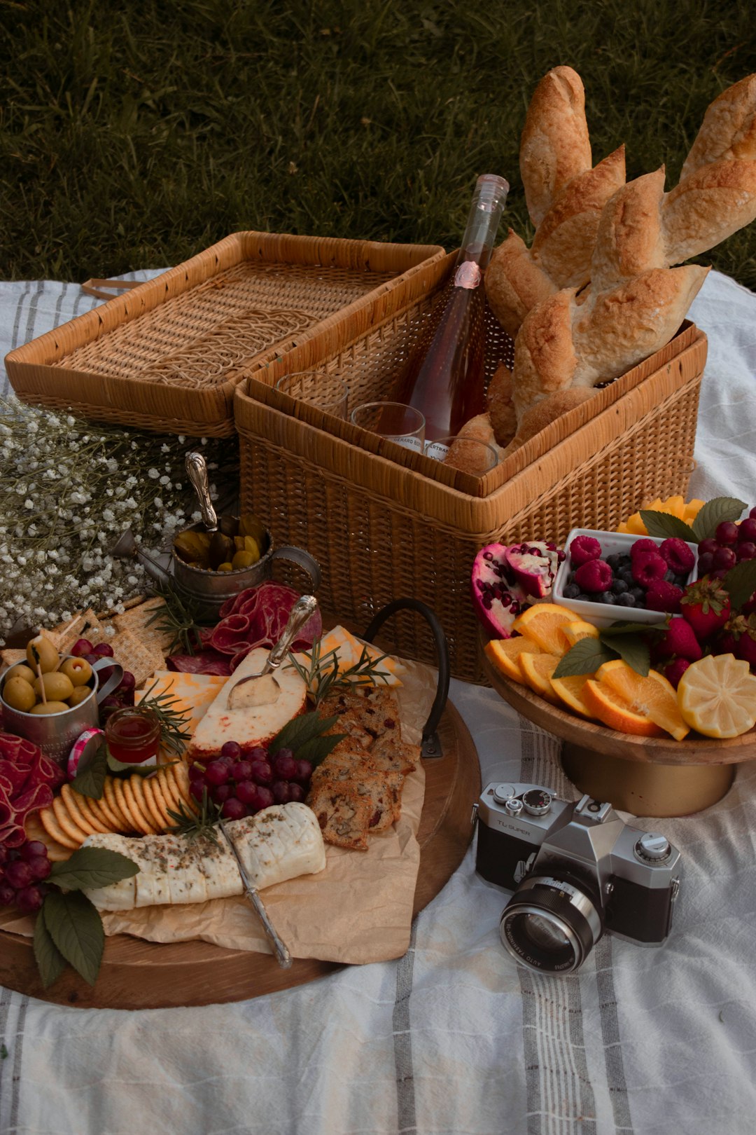 brown wicker basket with fruits and bread