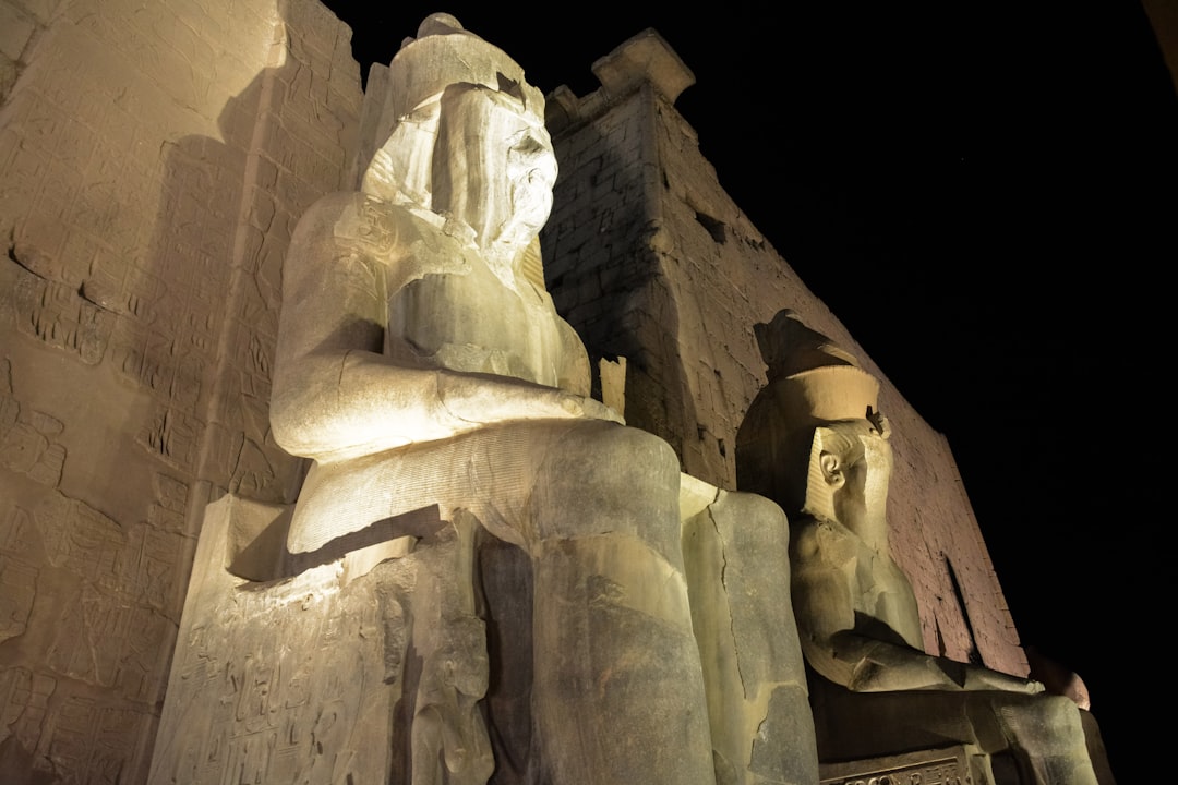 low angle photography of brown concrete statue