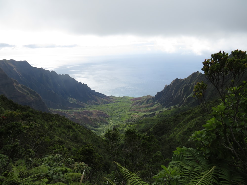 green mountains under white clouds during daytime