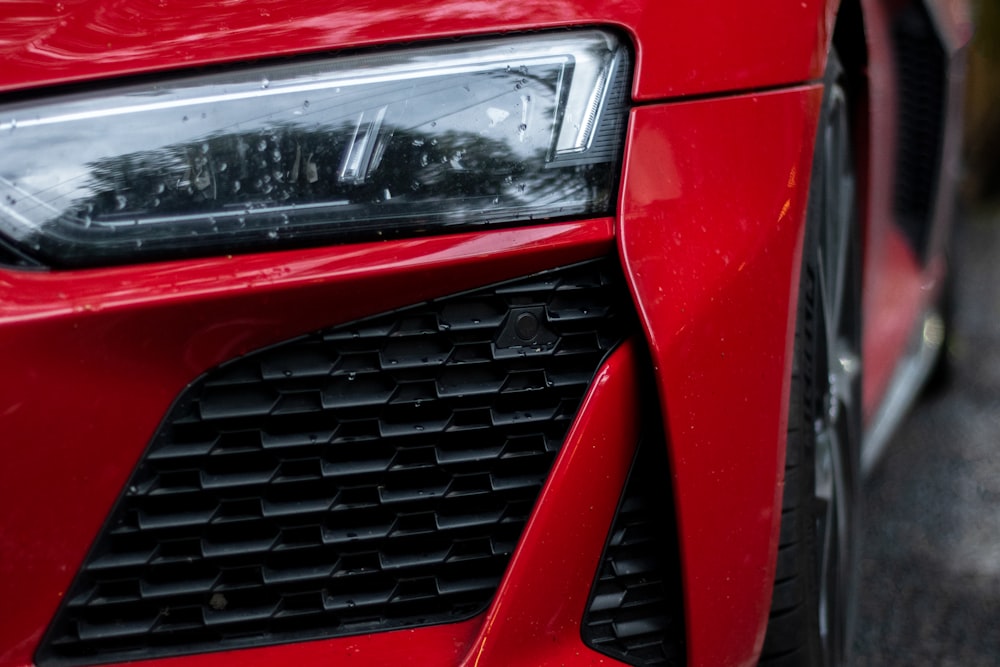 red car with white and black license plate