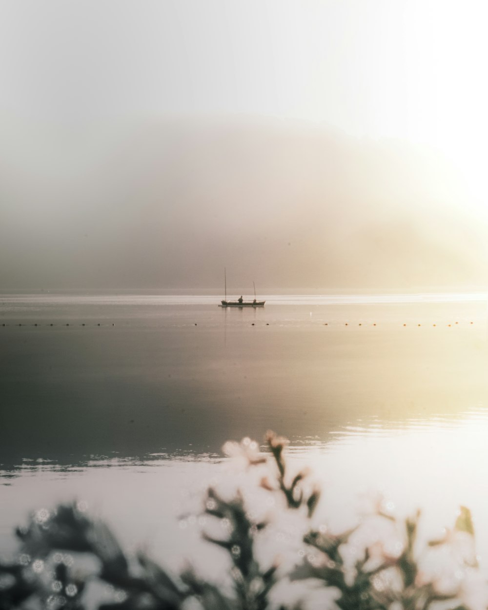 body of water during foggy weather