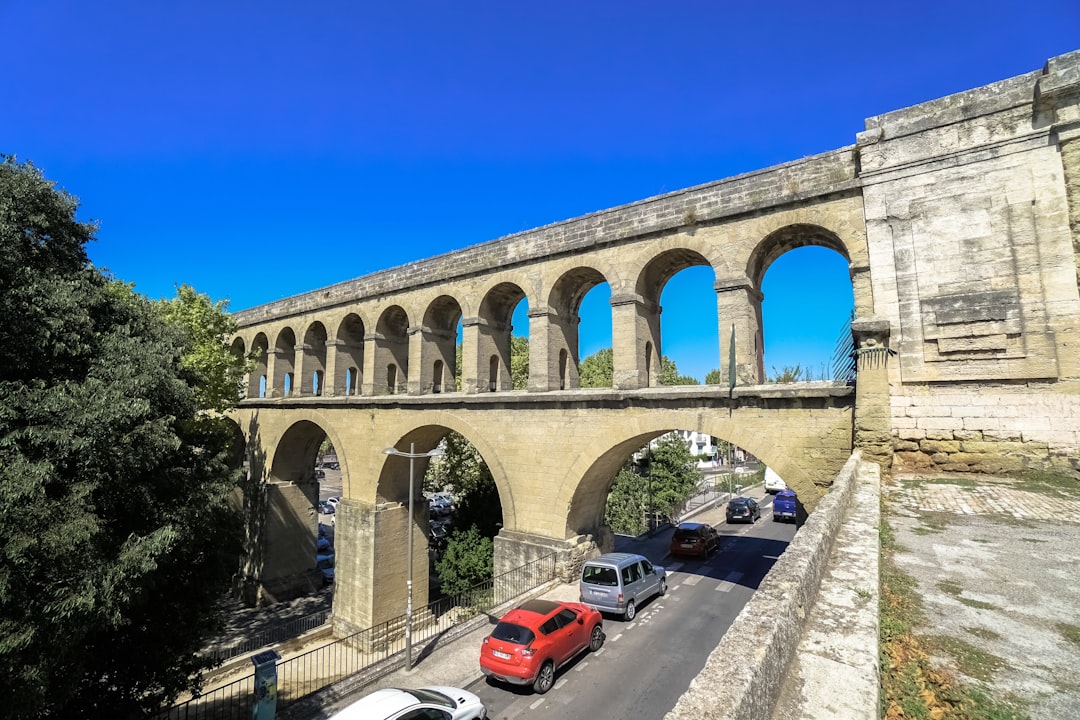 cars on road under blue sky during daytime