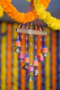 brown wooden hanging decor with yellow and red hanging decors