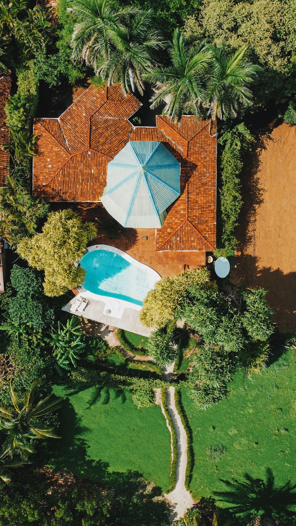 Beautiful villa with pool and garden in bird's eye view