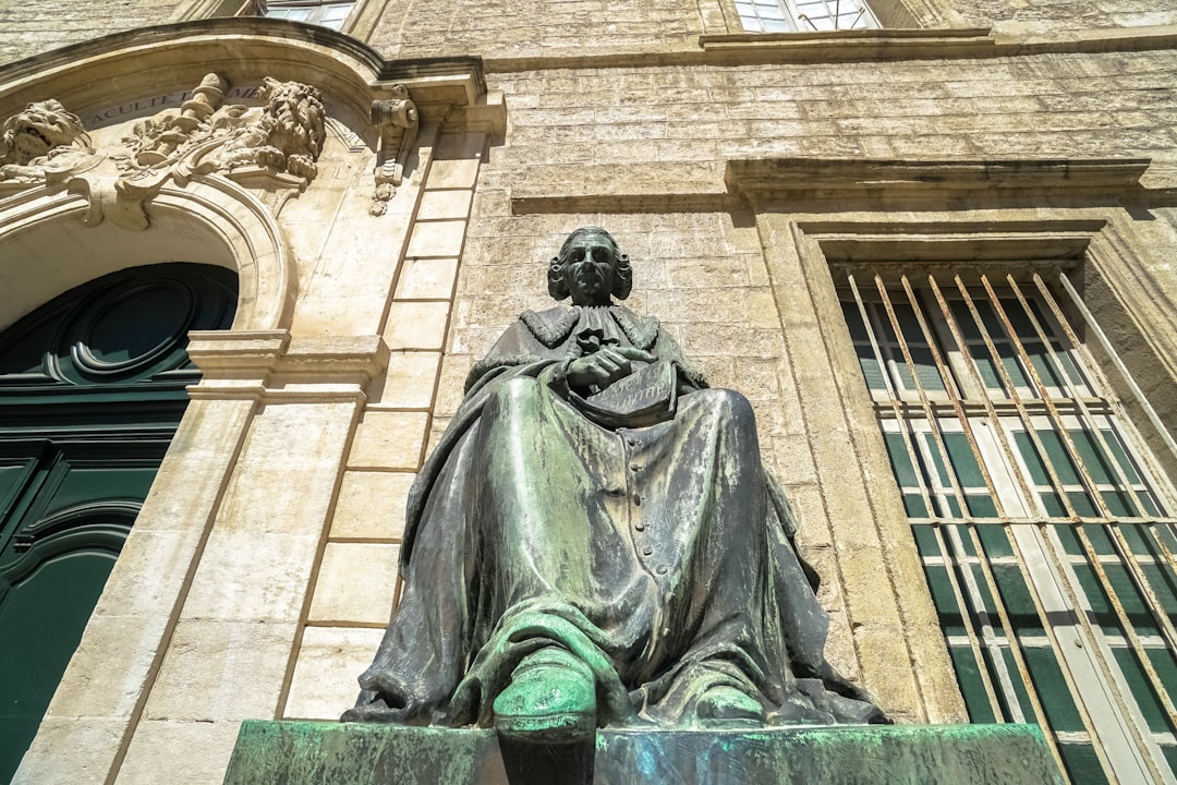 man in black suit statue