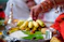 person holding sliced green fruit