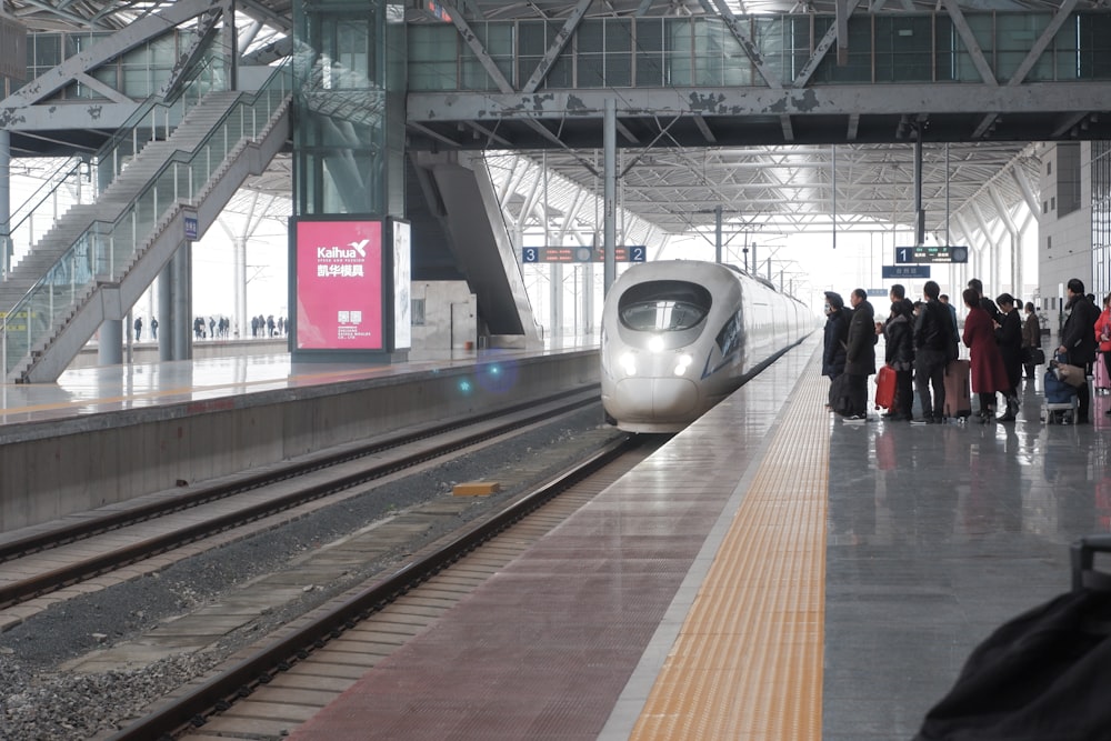 people walking on train station during daytime