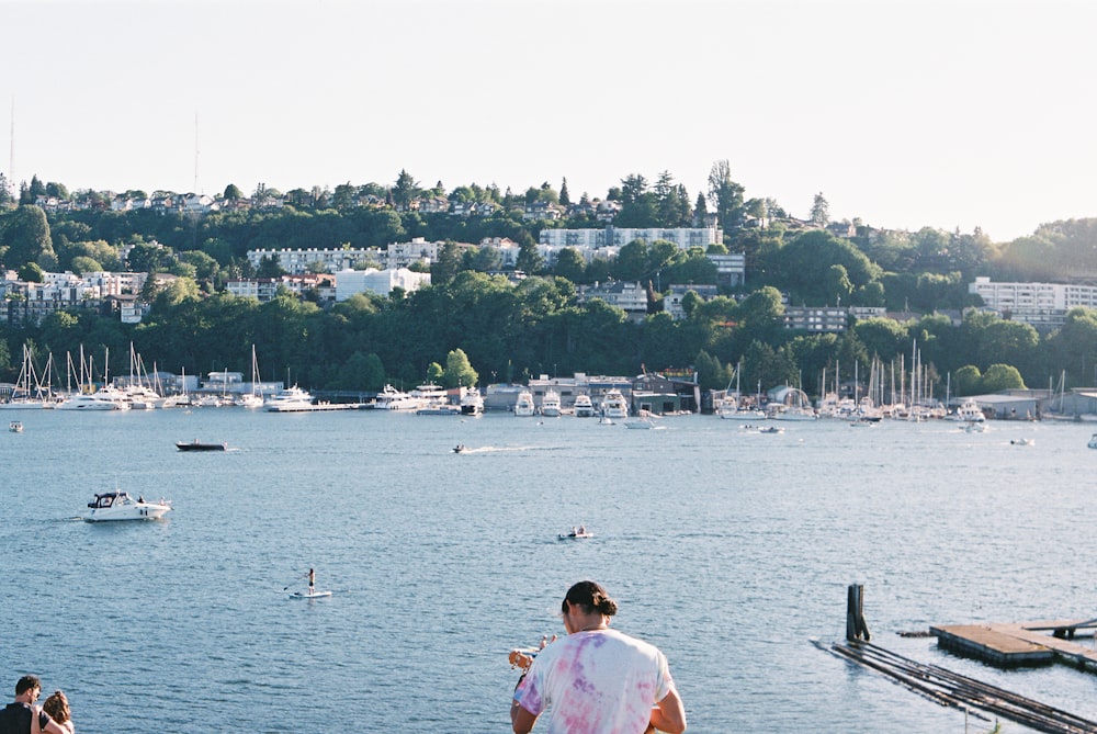 man in white shirt sitting on boat during daytime