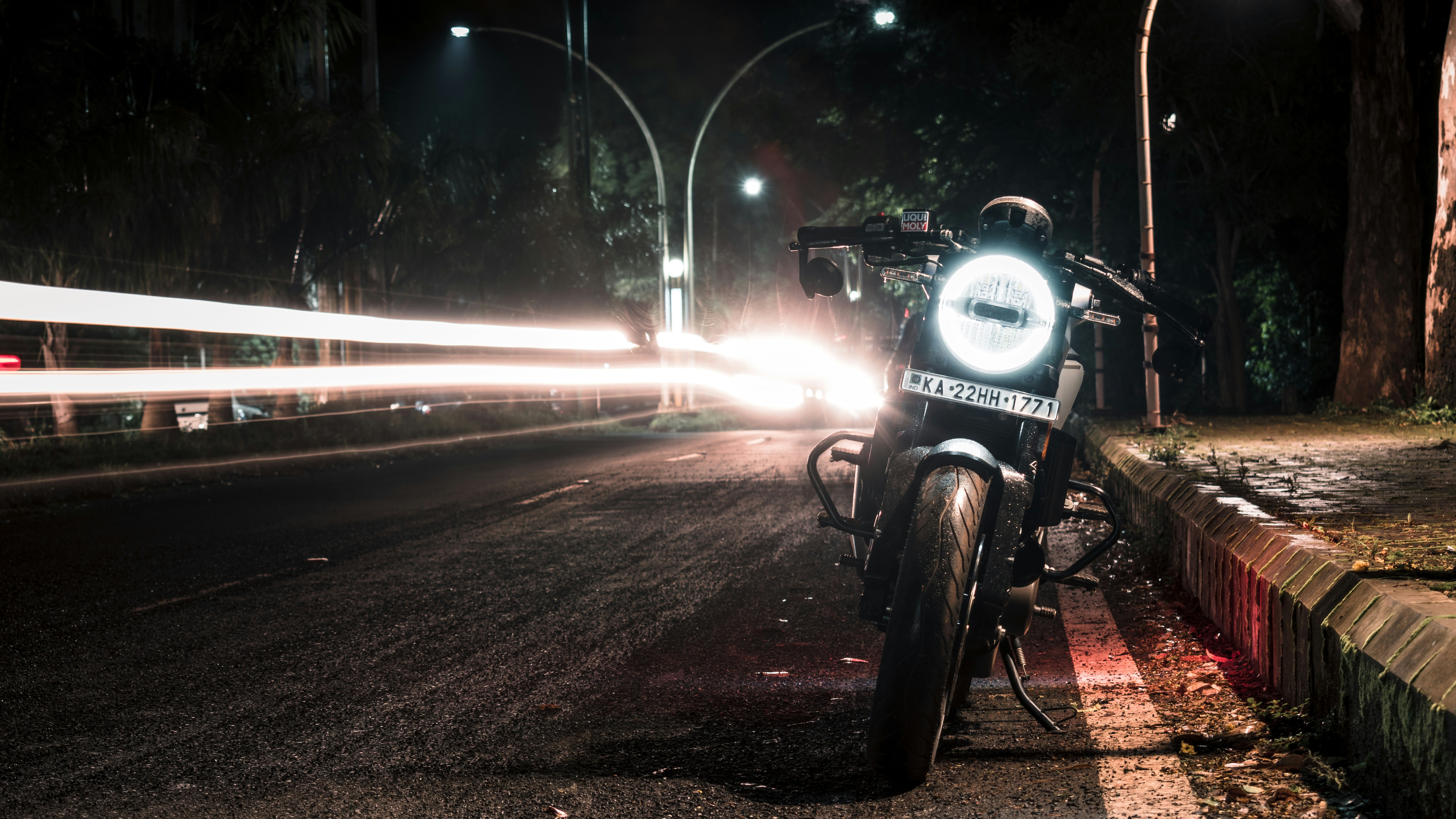 Light leaks on a road with a parked Husqvarna 