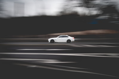 white porsche 911 on road during daytime