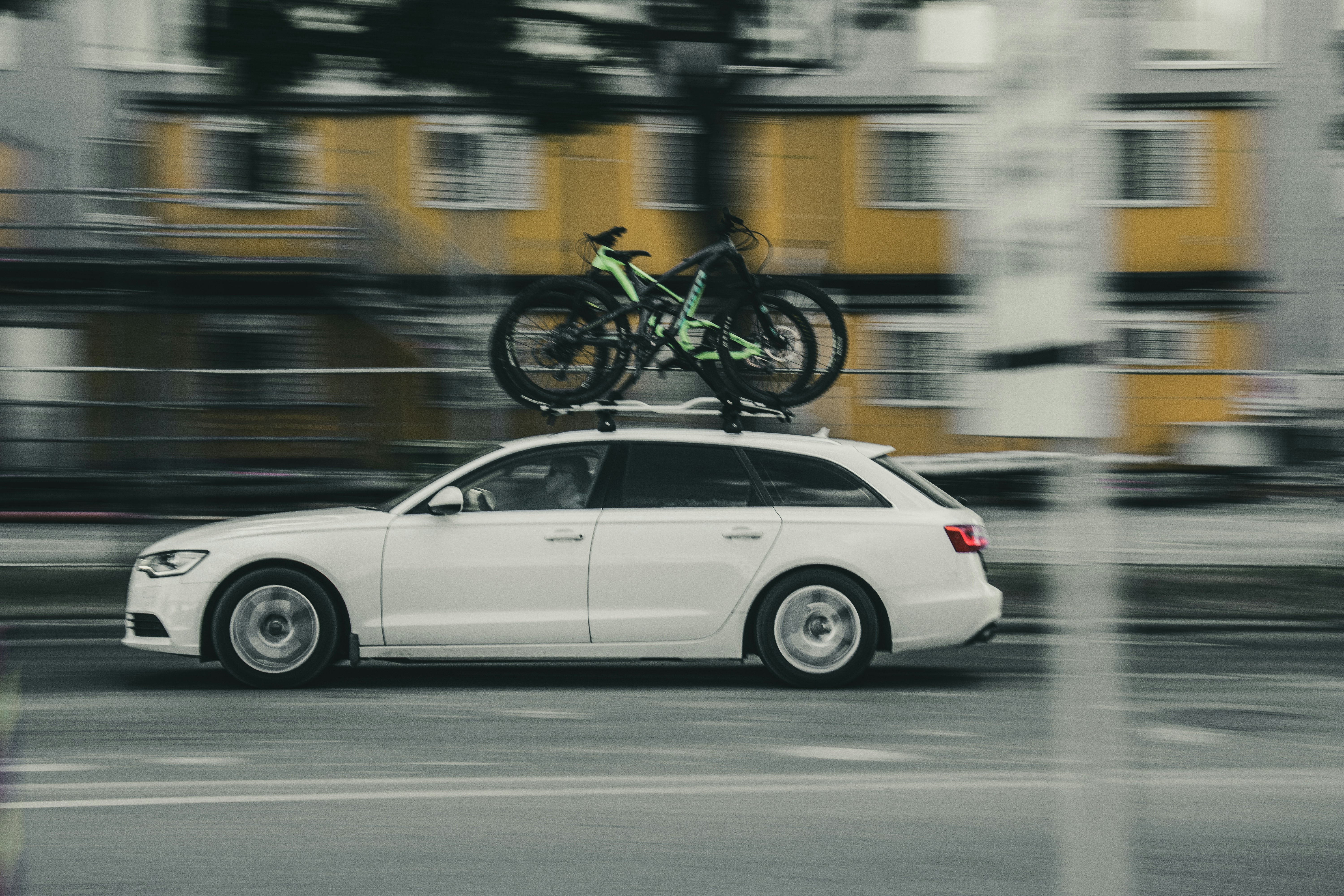 white sedan on road during daytime