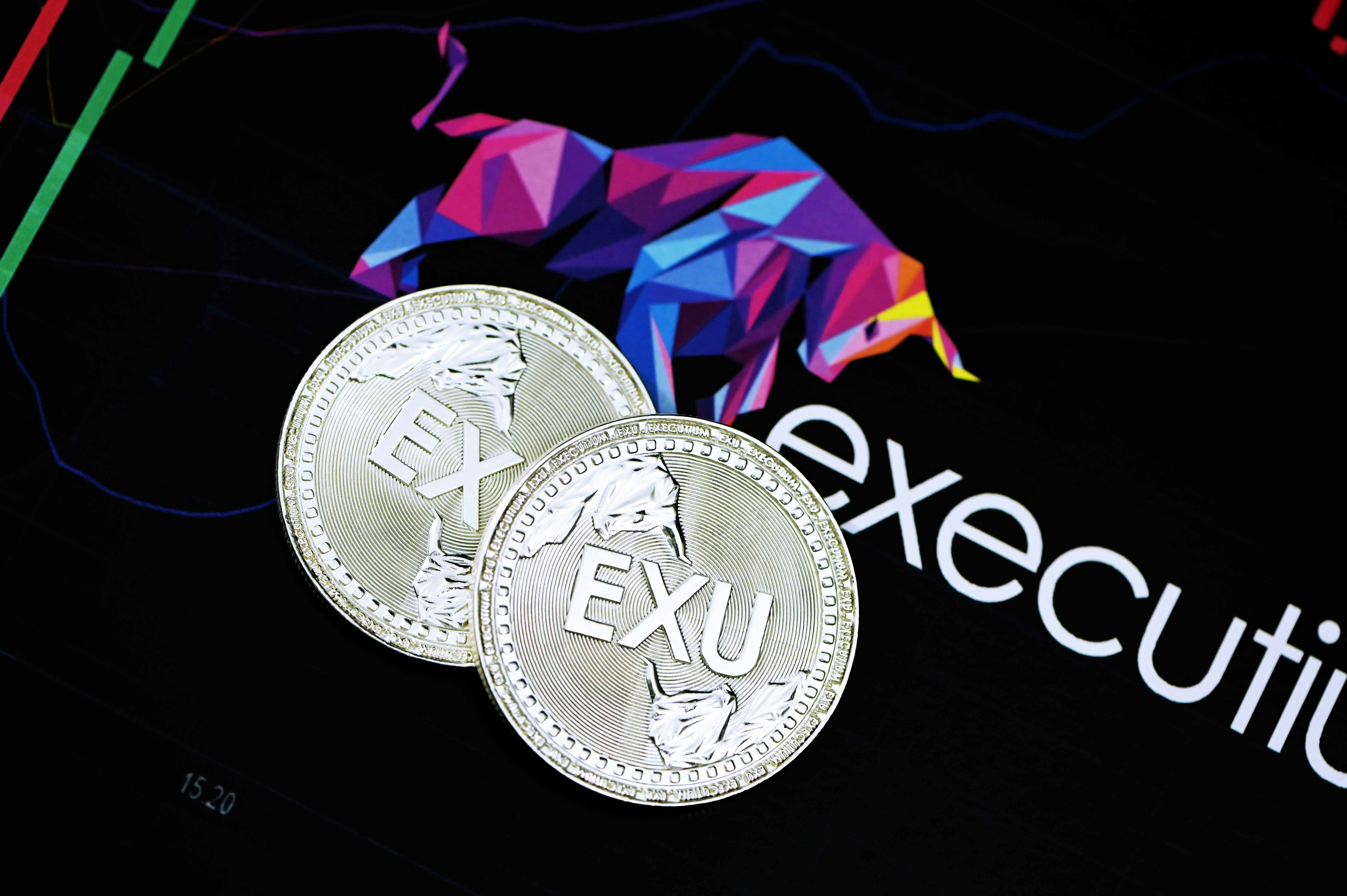 Two Executium coins with the Executium logo