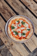 pizza on brown wooden table