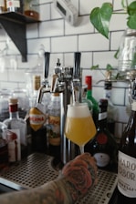 clear glass bottle with yellow liquid inside