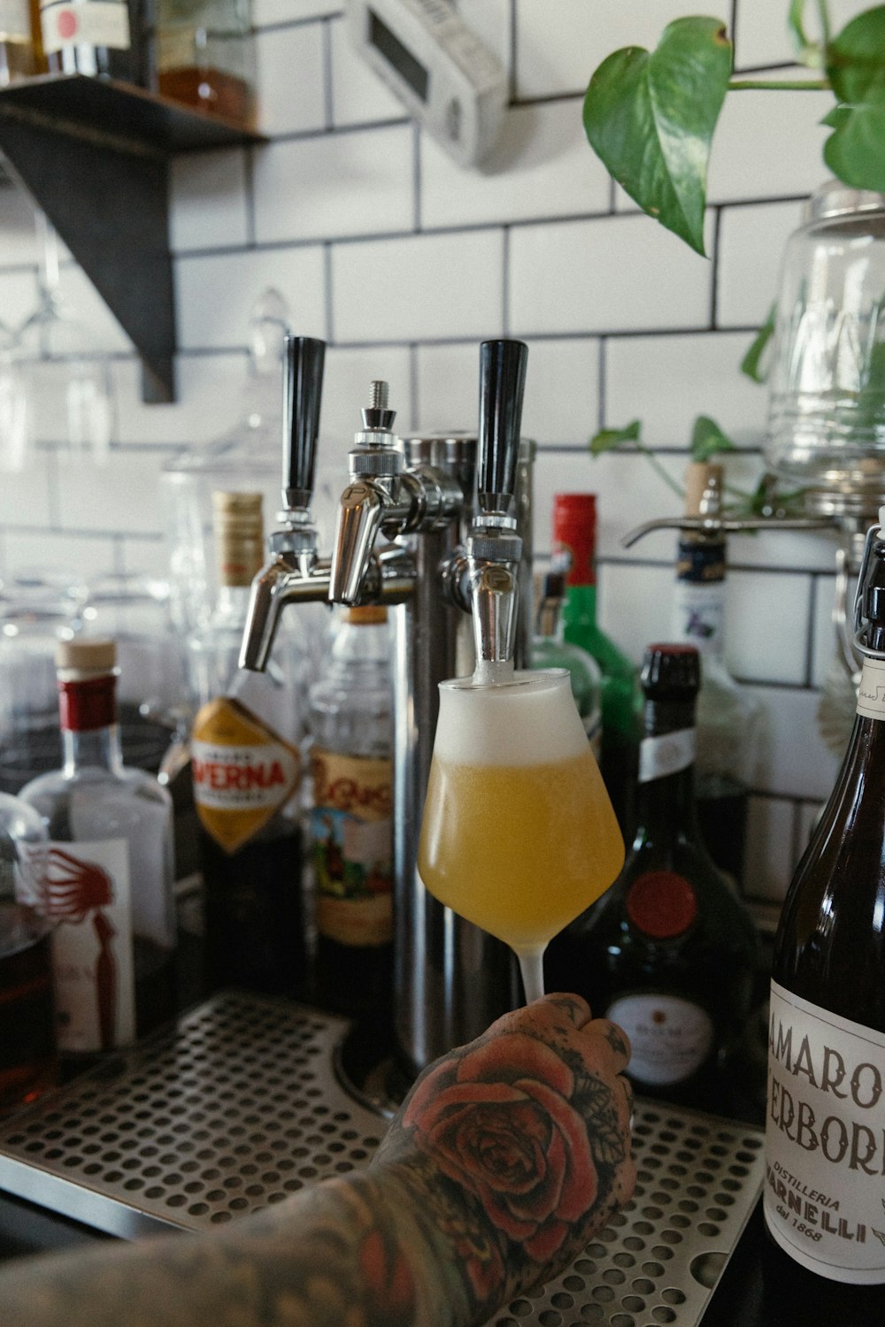 clear glass bottle with yellow liquid inside