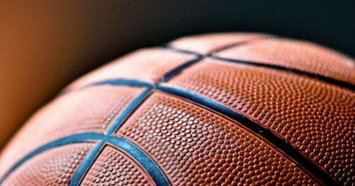 brown and black basketball ball