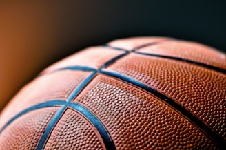 brown and black basketball ball