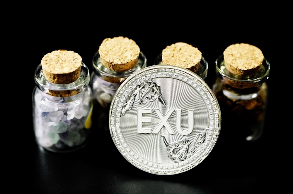 two clear glass jars with brown and white cookies