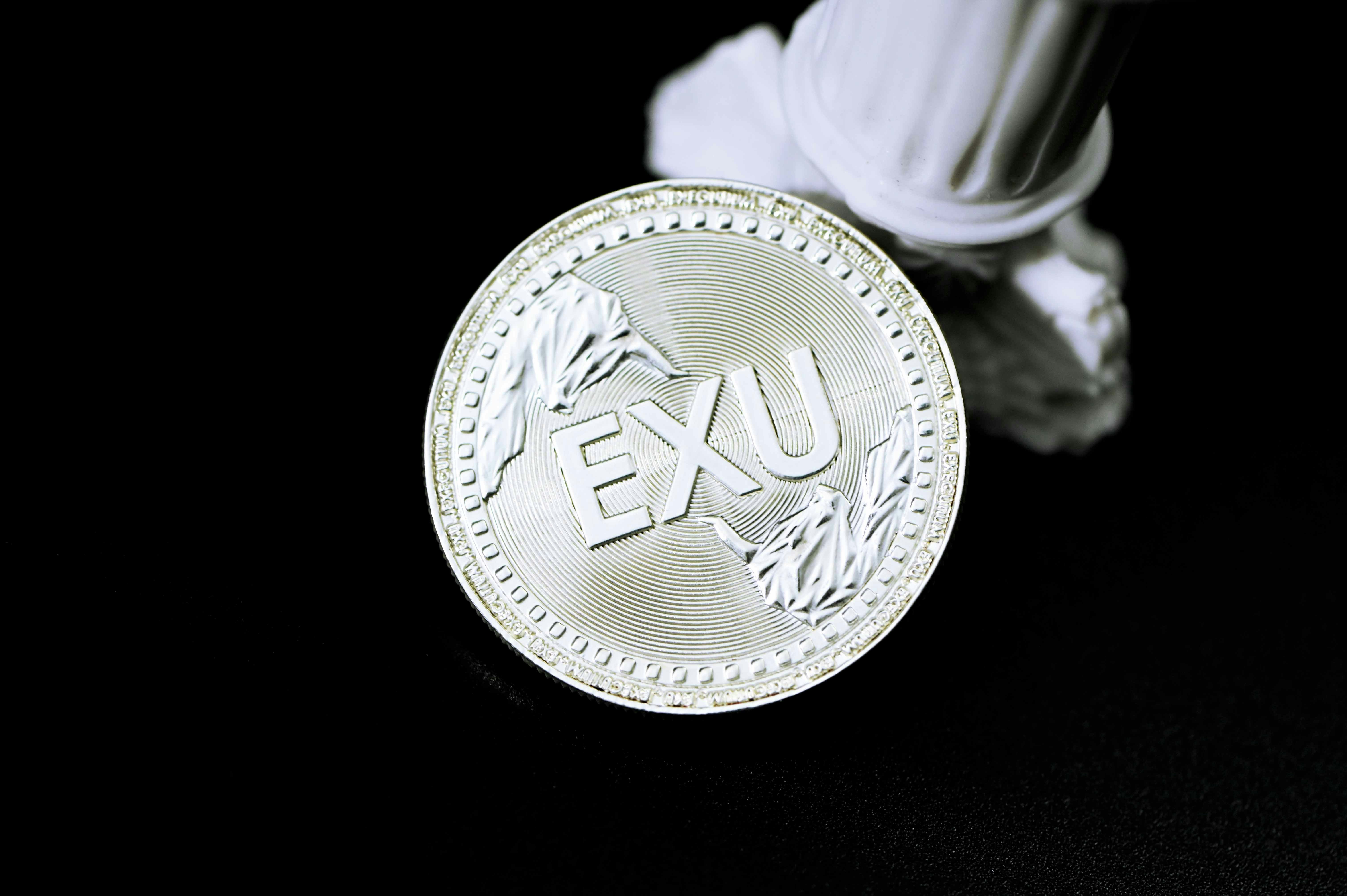 silver and gold round coin