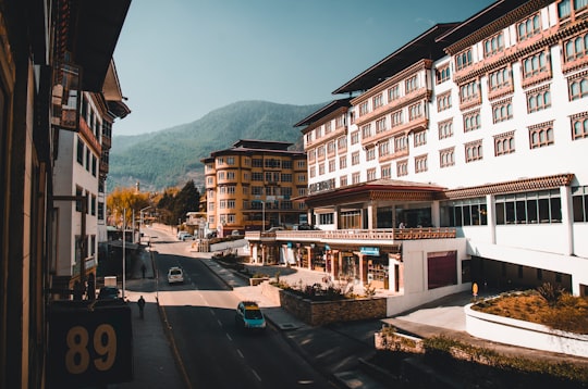 cars parked in front of building during daytime in Thimphu Bhutan