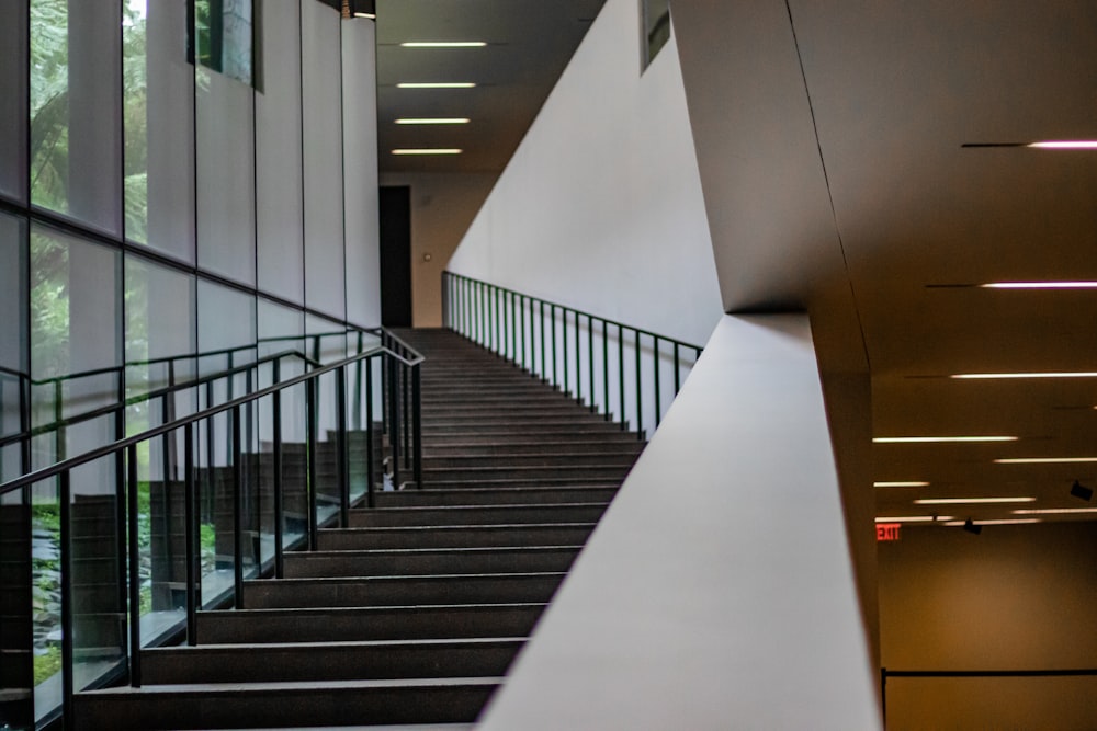 white concrete staircase with black metal railings