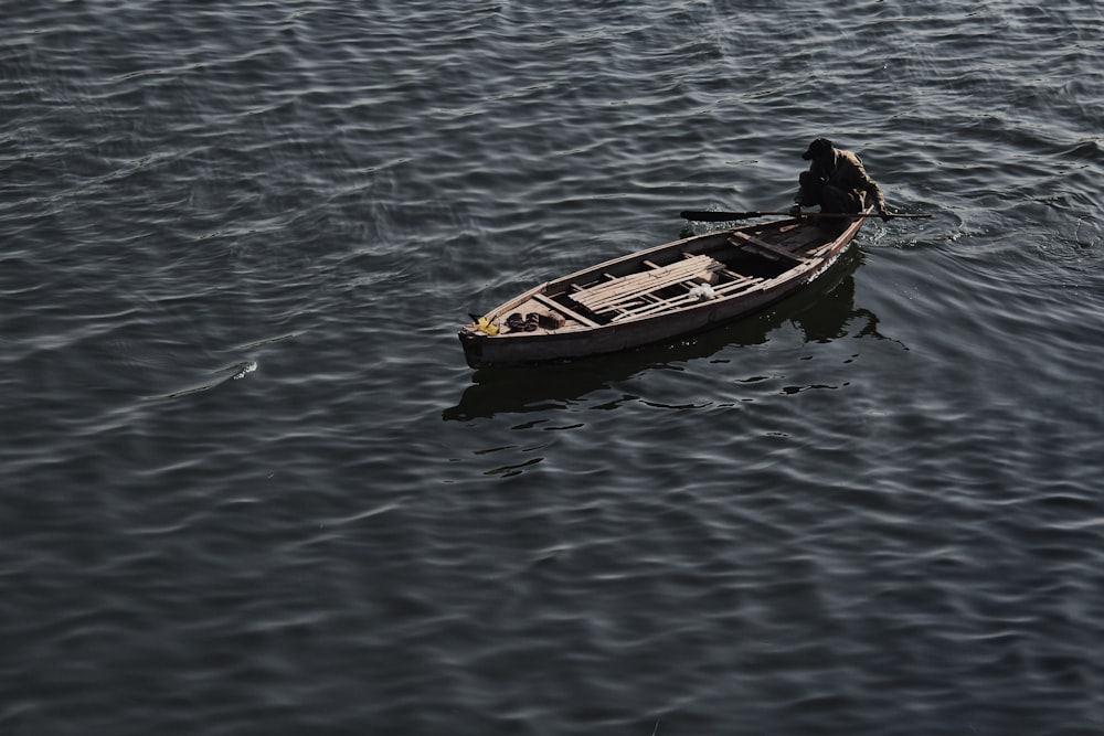 brown boat on body of water during daytime