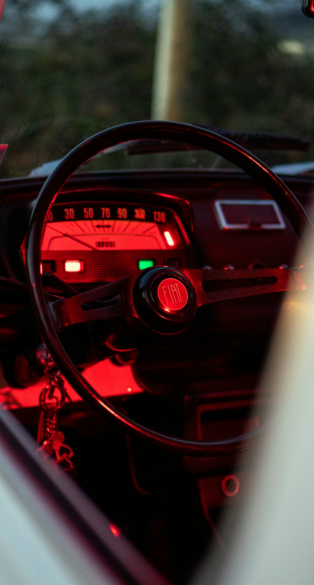 black and red car steering wheel