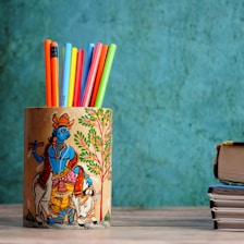 woman in yellow dress holding book drawing