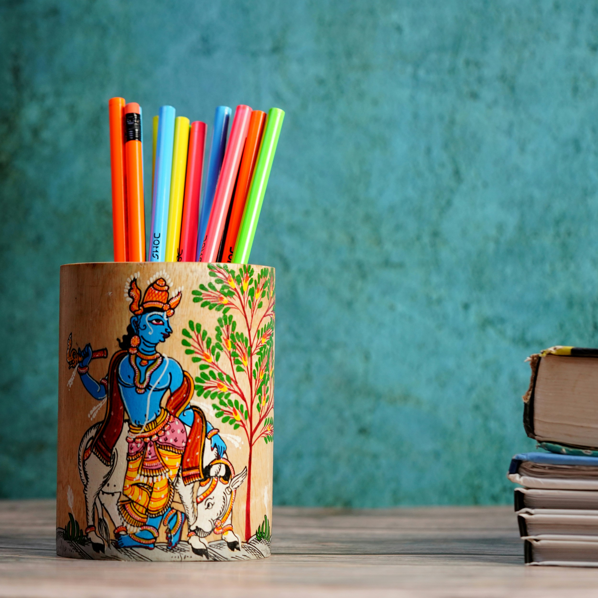 woman in yellow dress holding book drawing