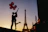 Elegant couple enjoying a sunset view from a luxury hotel balcony in Paris.