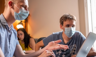 man in gray crew neck t-shirt wearing white face mask