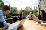 A diverse group of people collaborating on sustainability projects.