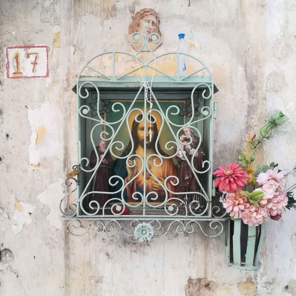 black metal window grill with pink flowers