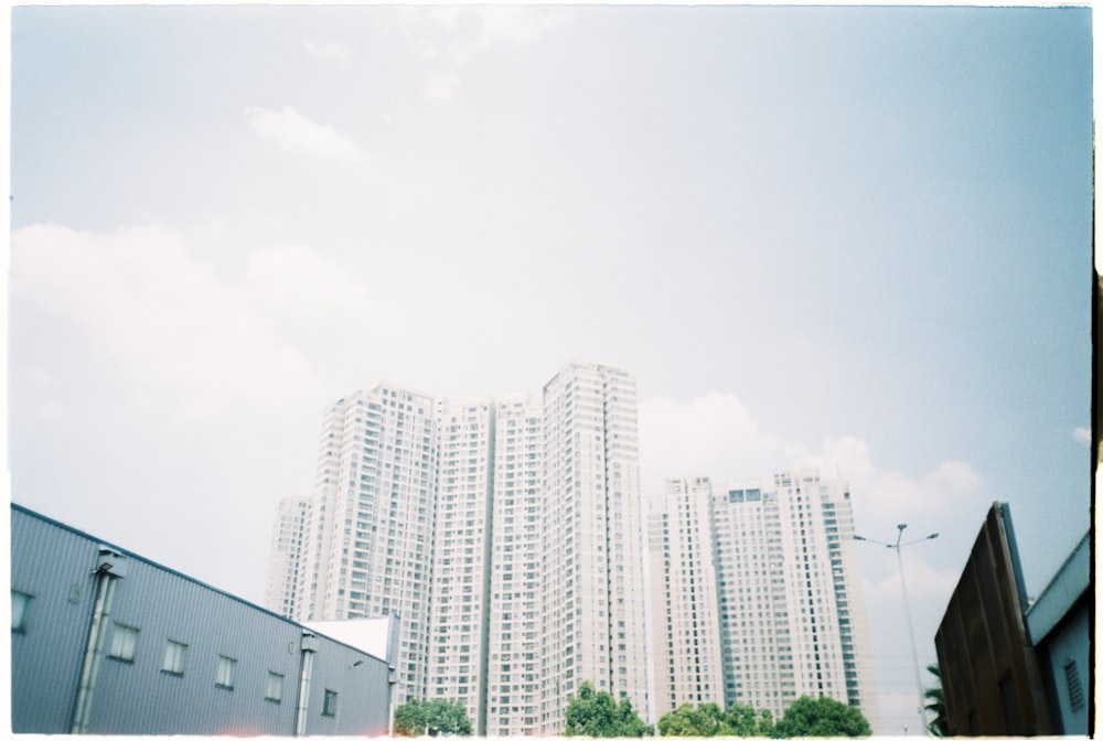 white concrete building near green trees during daytime