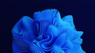 A complex, abstract structure composed of layered, flowing lines and shapes in vivid blue, resembling a three-dimensional wave or organic form against a dark background.