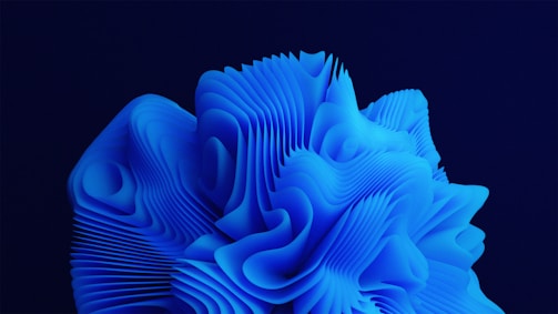 A complex, abstract structure composed of layered, flowing lines and shapes in vivid blue, resembling a three-dimensional wave or organic form against a dark background.