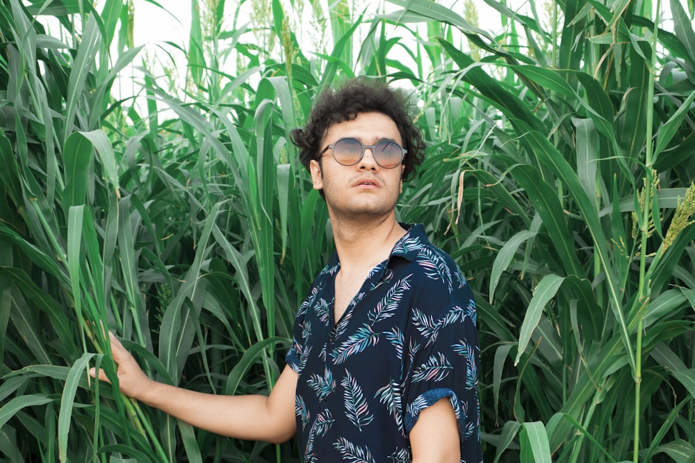 woman in black and white floral shirt wearing black sunglasses