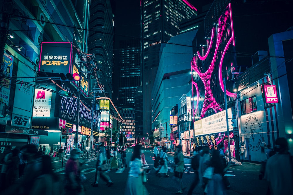 people walking on street during nighttime