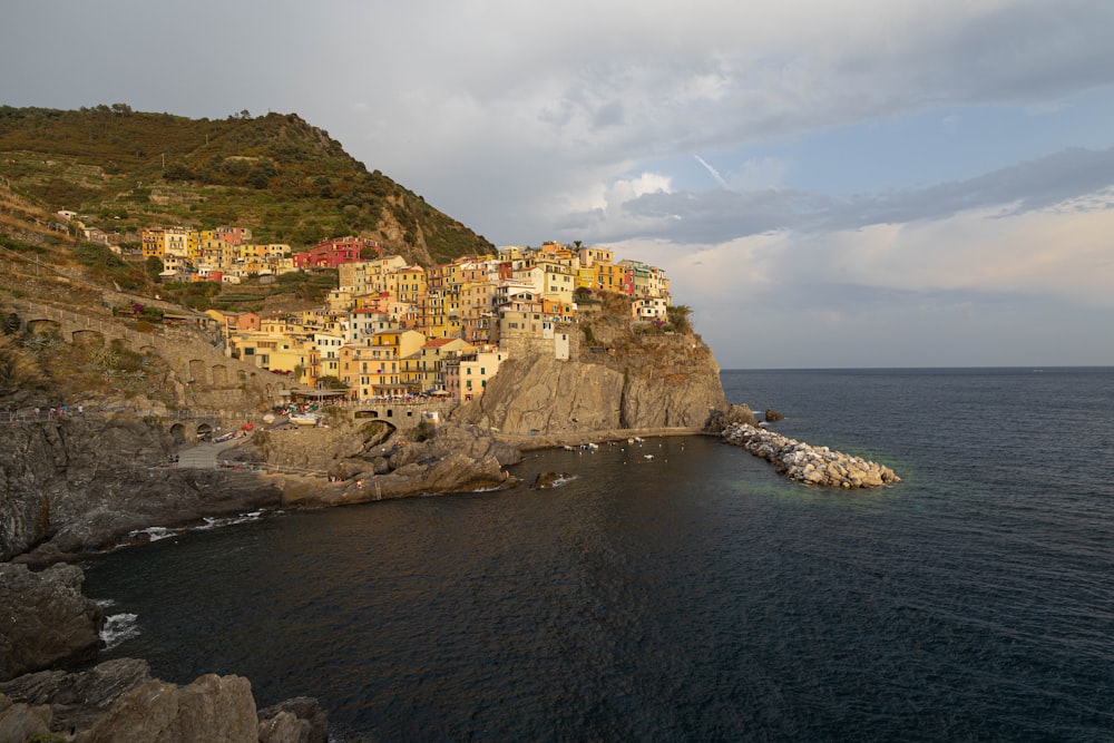 a small village on a cliff above the ocean